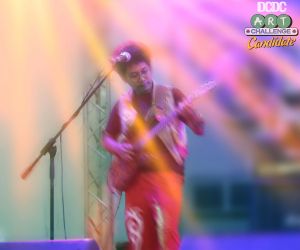 Abed "Obat Bius" on Guitar, Doused with Light